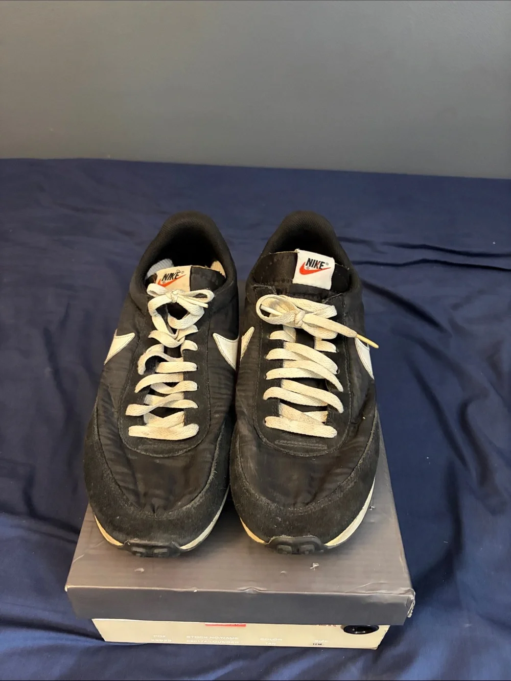 Nike Black Sneakers with White Swoosh and Cream Midsole